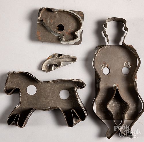 Four tin cookie cutters