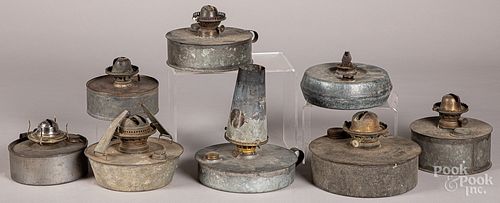 Eight tin fluid lamps, 19th c.
