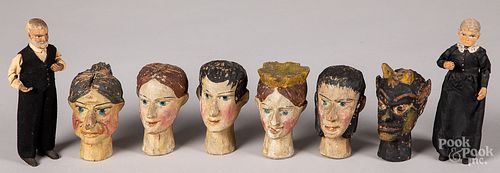 Painted and carved wood puppet heads
