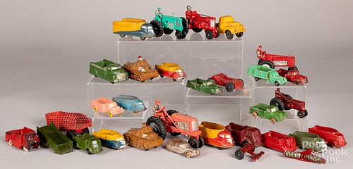 Collection of hard rubber toy trucks and tractors
