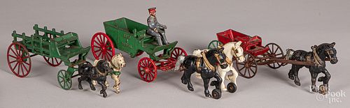 Three cast iron horse drawn wagons