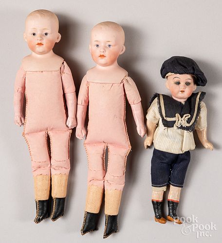 Three small bisque boy dolls