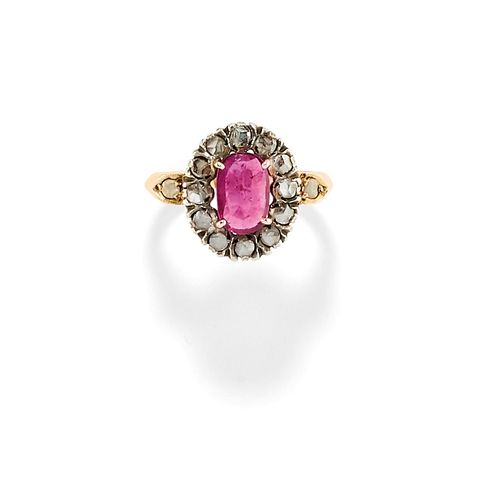 A silver, 10K yellow gold, ruby and diamond ring