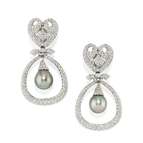 A 18K white gold, cultured pearl and diamond earclips