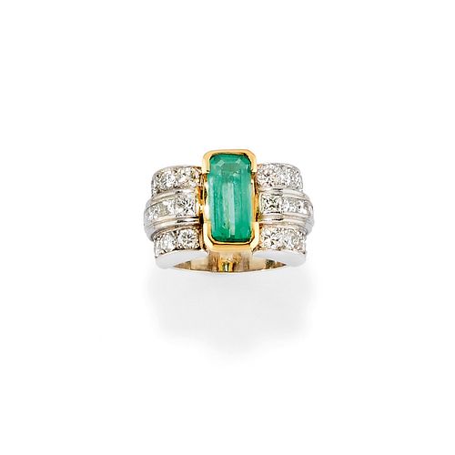 A platinum, 18K yellow gold, emerald and diamond ring