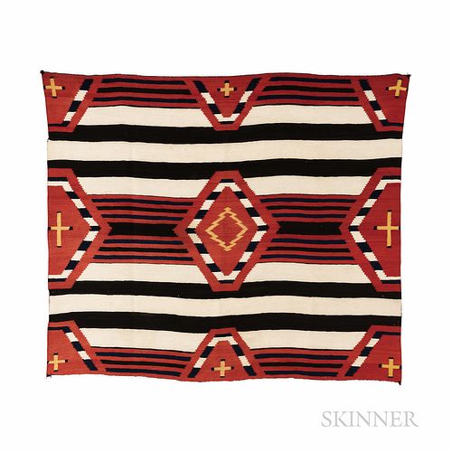 Late Classic Navajo Chief's Blanket, finely woven in natural yellow and cream, two different indigo dyes, dark brown and synthetic red