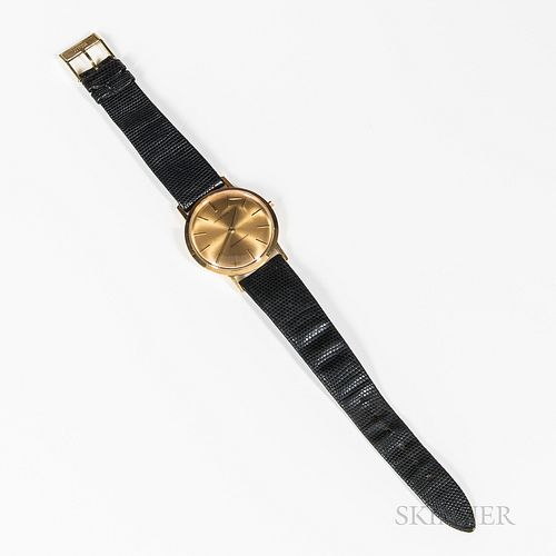 Juvenia Wristwatch, with a 21-jewel gold movement marked 18K, and a faux-shagreen band.