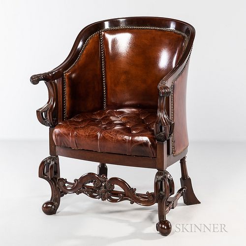 Carved and Tufted Leather-upholstered Armchair, 20th century.