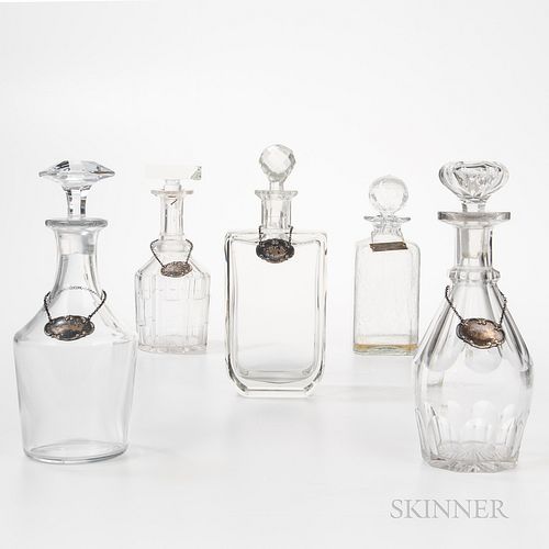 Five Varied Colorless Glass Decanters with Four Tiffany & Co. Sterling Silver Liquor Tags.