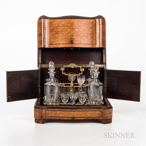 Marquetry Liquor Box, late 19th/early 20th century, the hinged sides, top, and front open to reveal and fitted interior with decanters