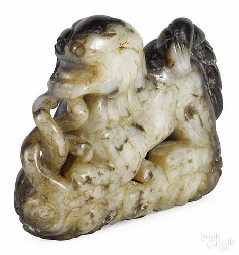 Chinese carved white and black jade figure of a