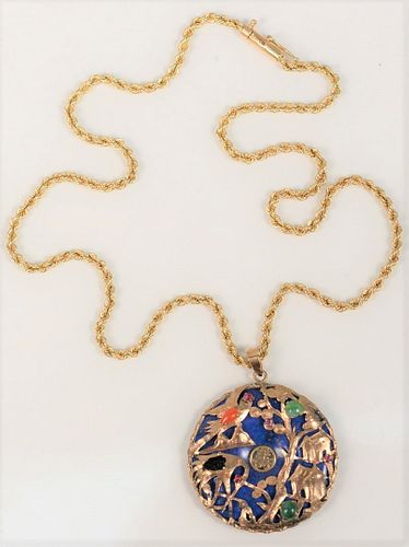 Chinese Carved Blue Lapis Disc Pendant
mounted with gold birds, and various stones, on 14 karat gold chain (one stone missing)
diameter 34 millimeters