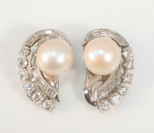 Pair of Platinum Pearl and Diamond Crescent Earrings
pearls measure approximately 9.5 millimeters each, inside a double crescent, outside crescent has