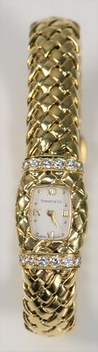 Tiffany & Company 18 Karat Gold Ladies Wristwatch
set with sixteen diamonds, having 18 karat gold mesh band, in original Tiffany & Company box
total w