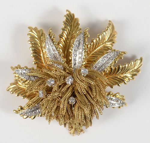 18 Karat Gold Leaf-Style Brooch
six fern leaves set with diamonds and gold tassels, approximately one hundred fourteen diamonds
width 2 1/2 inches
49.