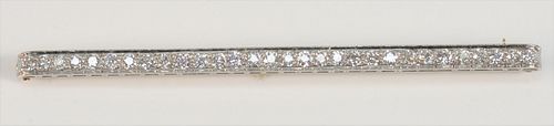 Tiffany & Company Platinum and Diamond Bar Pin
set with thirty diamonds, in original Tiffany & Company box
approximately 3 carats
length 3 1/2 inches
