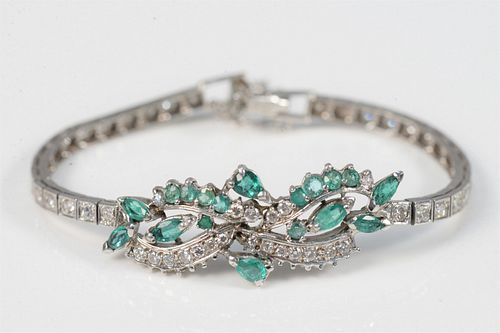 14 Karat White Gold Bracelet
set with emeralds, and diamonds
length 7 inches
15.8 grams