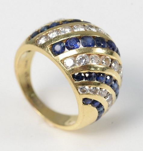 18 Karat Gold Dome Ring
set with blue sapphires and diamonds
signed Nova
size 6 3/4
10.3 grams