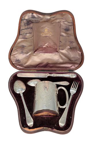 Edward Barnard & Sons Silver Five Piece Travel Set in a fitted box, to include fork, knife, two spoons and mug, all with chased designs and monogramme