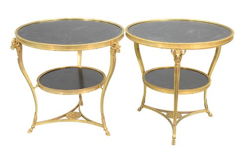 A Pair of Gueridon Tables
having two tier round, black, slate, top shelves 
on cabriole legs, with ram's head mask, on hoof feet
height 27 inches, dep