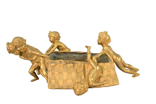 Raoul Francois Larche (1860 - 1912)
French gilt bronze figural table flower basket, depicting children pushing and pulling the basket, inscribed Raoul