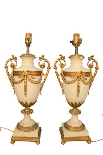 Pair of Large French Marble Urns
having Dore bronze fittings with swags and bands of laurel leaves, on square base, made into table lamps
height 22 1/