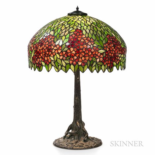 Mosaic Shade Table Lamp, United States, early 20th century, leaded glass shade with floral motif, patinated metal base in the form of a