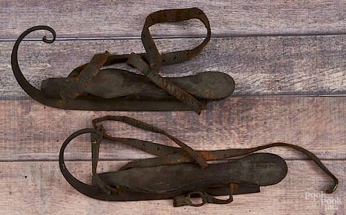 Pair of oak and steel ice skates, 19th c.