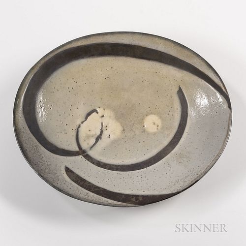 Chris Gustin (American, b. 1952) Studio Pottery Charger, United States, date 1985, oval form with gray gloss glaze over curves of matte