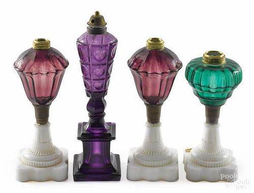 Four New England pressed glass fluid lamps, mid