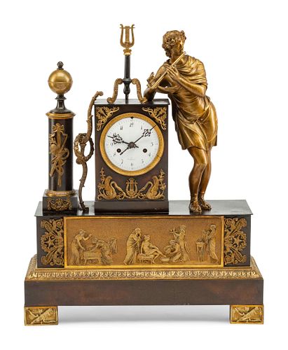 A Louis Philippe Gilt and Patinated Bronze Figural Mantel Clock