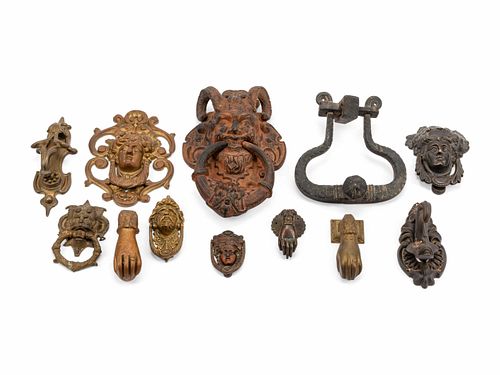A Collection of Twelve Continental Bronze Door Knockers