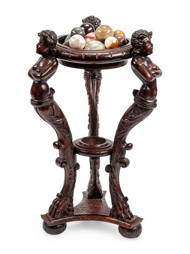 A Continental Carved Wood Jardiniere and Fifteen Marble Ornaments