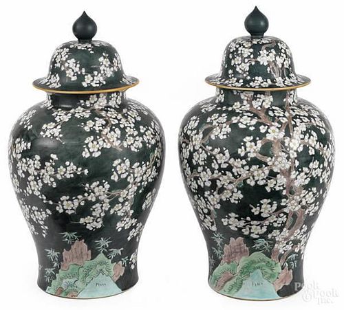 Pair of Chinese porcelain covered urns with pru