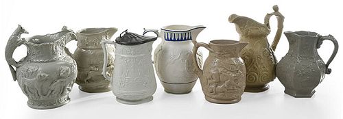 Seven Relief Molded Pitchers