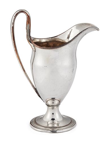 AN OLD SHEFFIELD PLATED CREAM JUG, of helmet form with reed