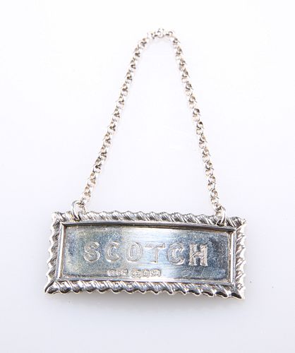 A VICTORIAN SILVER DECANTER LABEL, by Stokes & Ireland Ltd,