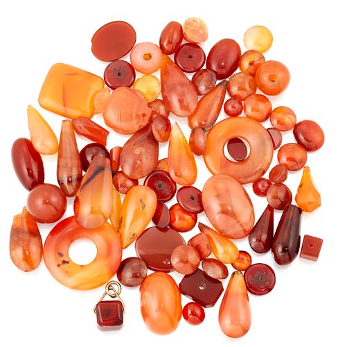 A QUANTITY OF WORKED CARNELIAN, INCLUDING CABOCHONS AND BEA