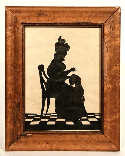 Cut Silhouette of a Lady Sewing