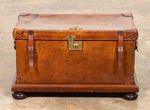 ENGLISH BARONET'S LEATHER TRUNK ON STAND, C. 1910