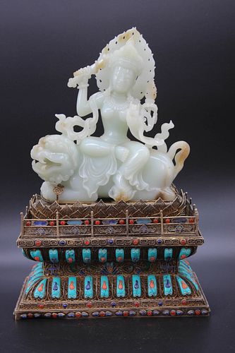 A Carved Sitting Bodhisattva Statue