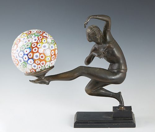 Art Deco Patinated Spelter Figural Lamp, 20th c., in the manner of Gerda Gerdago (1906-2004), of a dancer balancing a millefiore ball shade lamp on he
