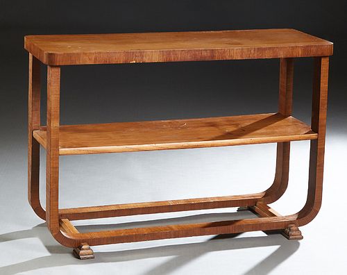 English Art Deco Carved Walnut Server, c. 1940, the rounded corner top on curved legs, joined by a center shelf and lower stretchers, on two stepped g