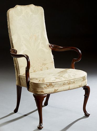 English George III Style Carved Mahogany Armchair, early 20th c., the canted arched cushioned back over two curved arms, to a bowed cushion seat, on c