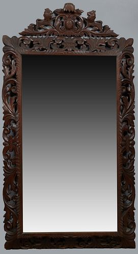 French Provincial Henri II Style Carved Oak Overmantle Cushion Mirror, late 19th c., with a pierced lion crest over a pierced leaf carved frame, H.- 7