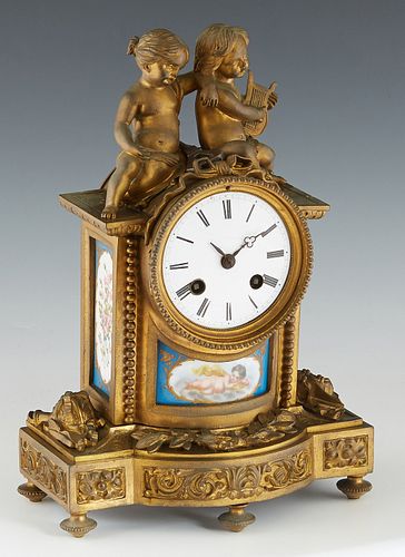 French Bronze and Sevres Mounted Figural Mantel Clock, 19th c., with two musical putti surmounts, over an enamel dial time and strike drum clock, abov