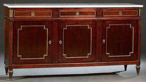 French Louis XVI Style Carved Mahogany Marble Top Sideboard, 20th c., the ogee edge white cookie corner marble, over three setback frieze drawers abov