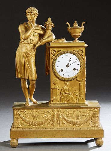 French Gilt Bronze Empire Style Figural Mantel Clock, mid 20th c., with a classically attired youth holding a cornucopia, leaning on an urn surmounted