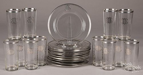 Twelve sterling silver mounted plates and glasses