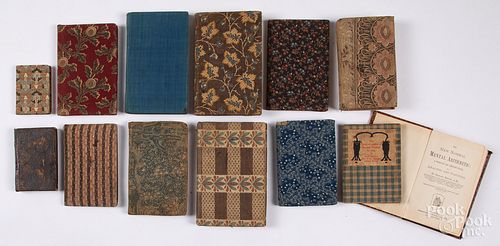 Group of early cloth bound school books.